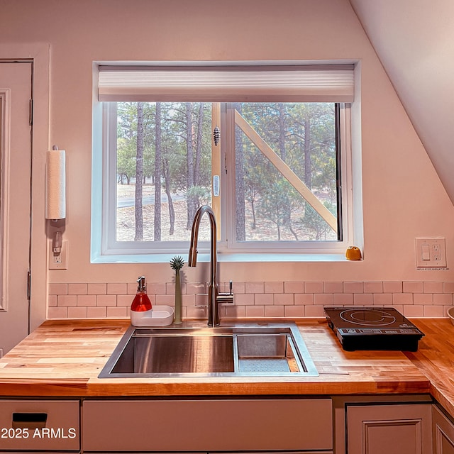 2124 Forest Park Dr, Overgaard, AZ 85933 - kitchen with a sink, backsplash, and wood counters