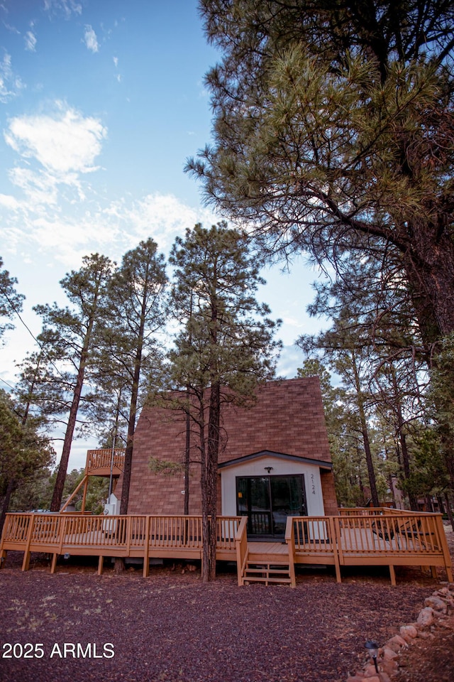 2124 Forest Park Dr, Overgaard, AZ 85933 - rear view of property with roof with shingles and a wooden deck