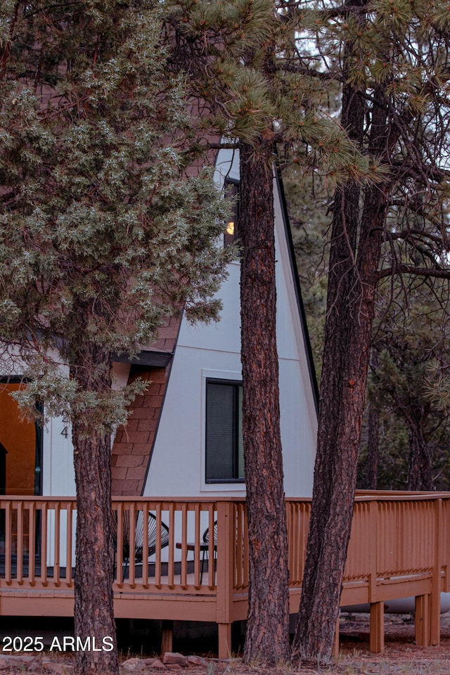 2124 Forest Park Dr, Overgaard, AZ 85933 - rear view of house featuring roof with shingles and a wooden deck