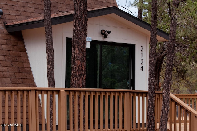 2124 Forest Park Dr, Overgaard, AZ 85933 - property entrance with roof with shingles and a deck