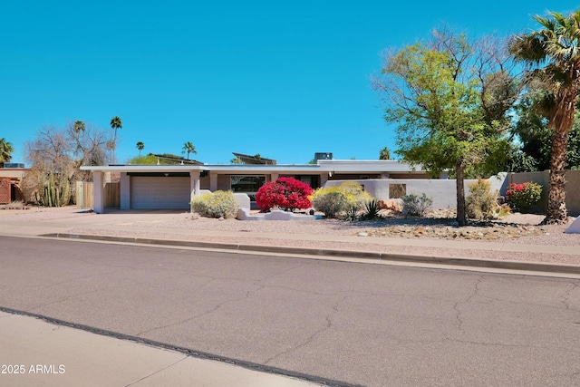 11035 N 37th St, Phoenix, AZ 85028 - view of front of home featuring stucco siding, fence, driveway, and a garage