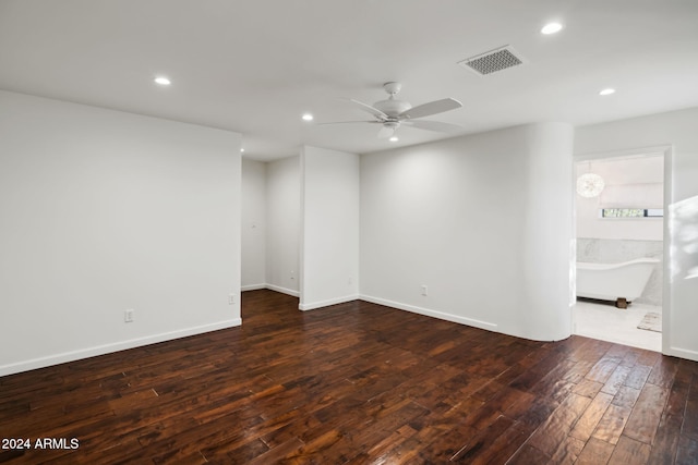 unfurnished room with dark wood-type flooring and ceiling fan