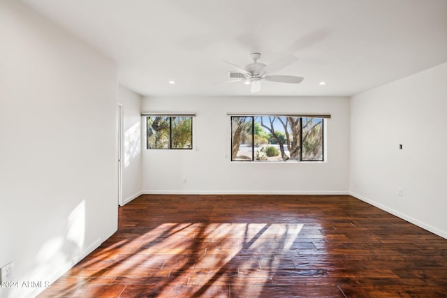 unfurnished room featuring dark hardwood / wood-style floors and ceiling fan