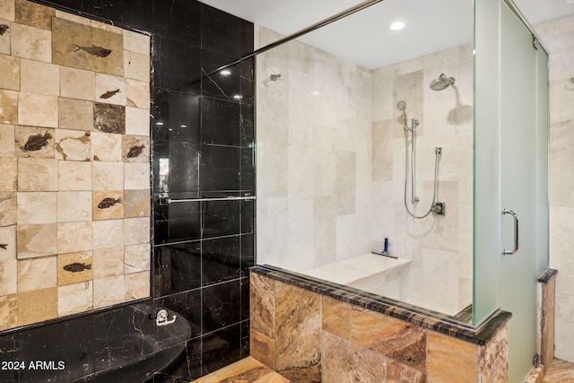 bathroom with a shower with shower door