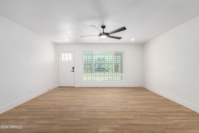 entrance foyer featuring light hardwood / wood-style floors and ceiling fan