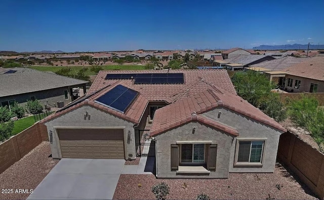 5490 W Trenton Way, Florence, AZ 85132 - view of front facade with a fenced backyard, driveway, stucco siding, and solar panels