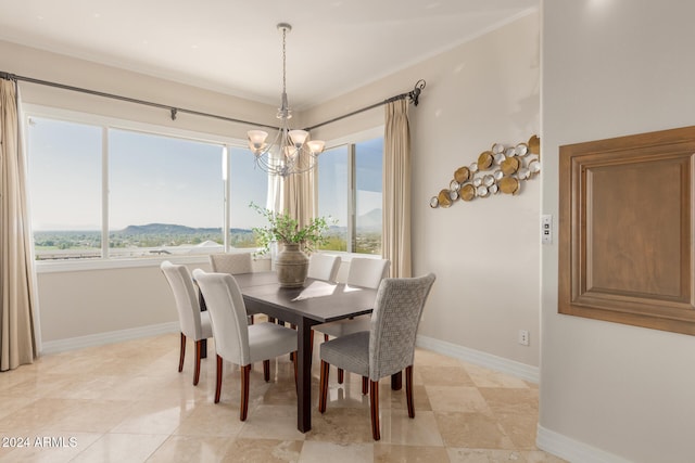 dining area with a notable chandelier and a mountain view