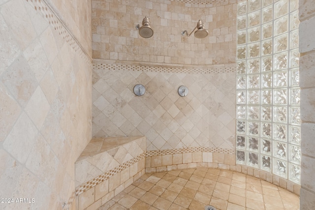 bathroom featuring a tile shower