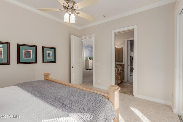 carpeted bedroom featuring ceiling fan, ornamental molding, and ensuite bath