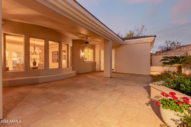 patio terrace at dusk with ceiling fan