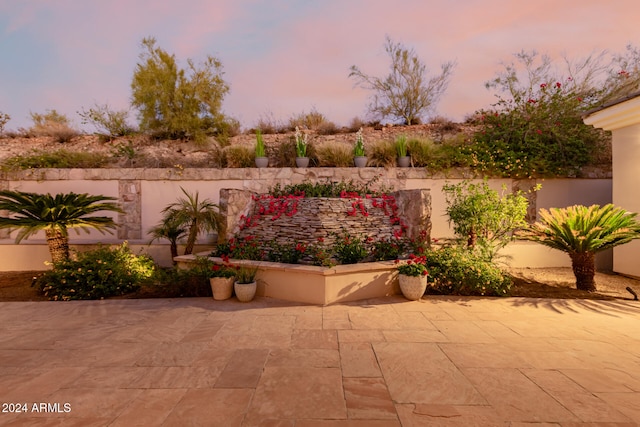 view of patio terrace at dusk