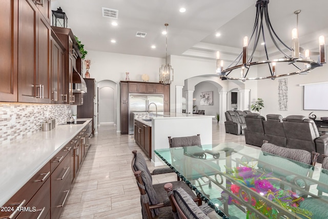 dining room with sink and decorative columns