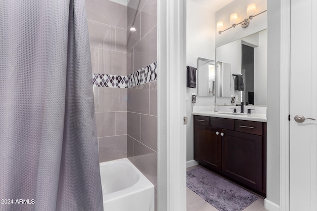 bathroom featuring vanity and shower / bathtub combination with curtain