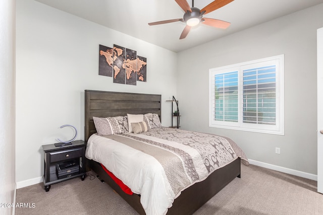 bedroom featuring ceiling fan and carpet