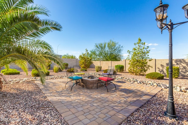 view of patio featuring a fire pit