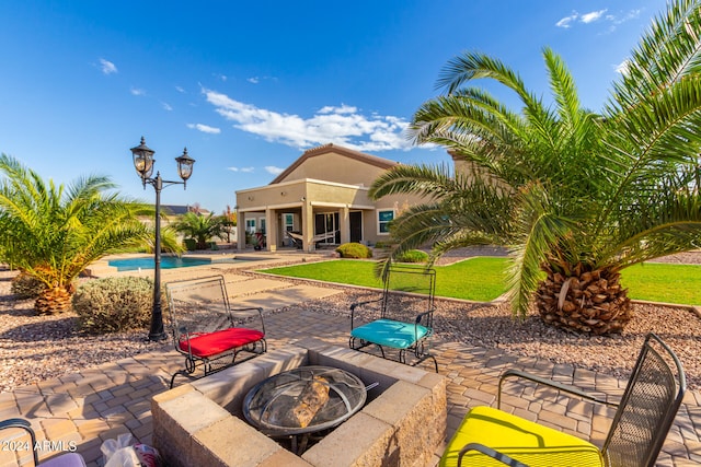 view of patio featuring a fire pit