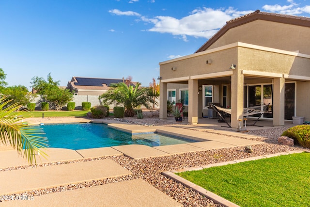 view of pool featuring a patio and a lawn