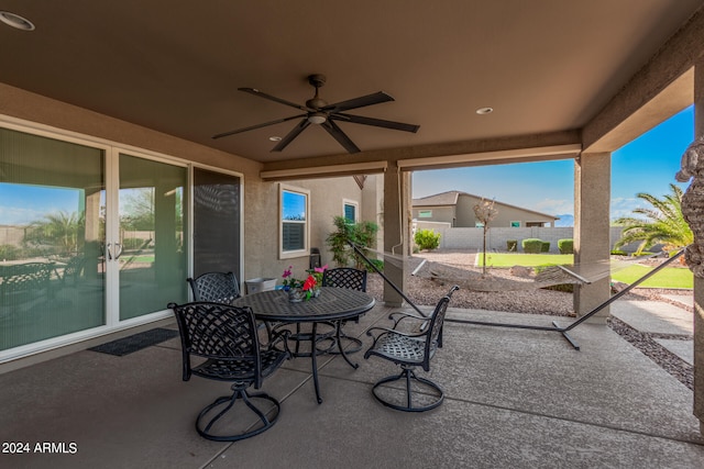 view of patio featuring ceiling fan