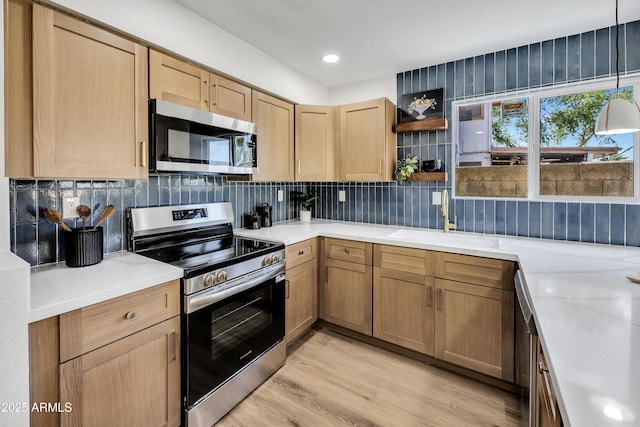 5122 W Mercury Way, Chandler, AZ 85226 - kitchen with appliances with stainless steel finishes, open shelves, light wood-type flooring, light countertops, and tasteful backsplash