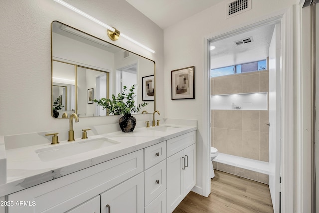 5122 W Mercury Way, Chandler, AZ 85226 - bathroom with double vanity, wood finished floors, and tiled shower