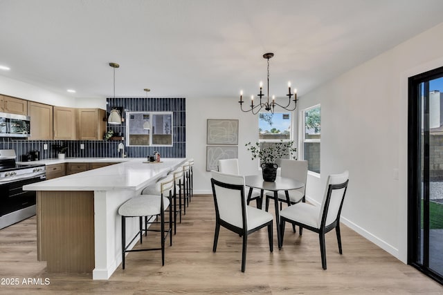 5122 W Mercury Way, Chandler, AZ 85226 - dining space featuring a chandelier, light wood-type flooring, and recessed lighting