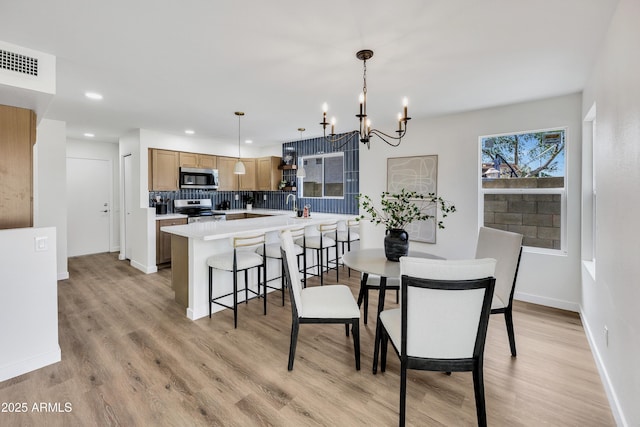 5122 W Mercury Way, Chandler, AZ 85226 - dining area featuring a chandelier, light wood-type flooring, and recessed lighting