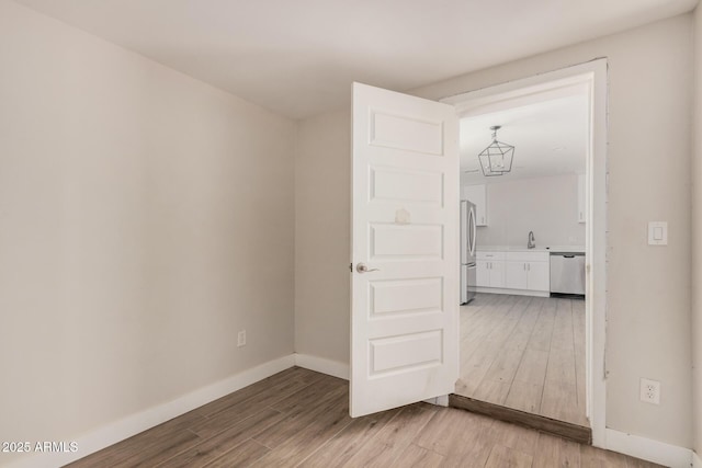 interior space featuring hardwood / wood-style floors and sink