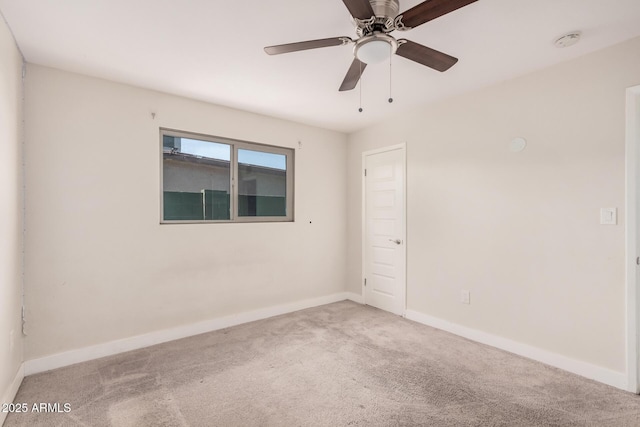 carpeted empty room with ceiling fan