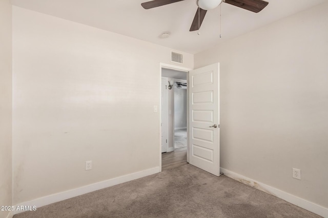 unfurnished bedroom featuring ceiling fan and light colored carpet