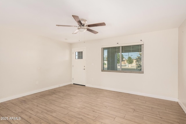 unfurnished room featuring ceiling fan and light wood-type flooring