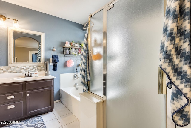 bathroom with vanity, decorative backsplash, tile patterned floors, and plus walk in shower