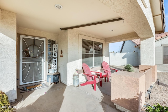 entrance to property with a patio