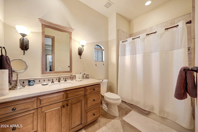 full bathroom with shower / bath combination with curtain, vanity, tile patterned floors, and toilet