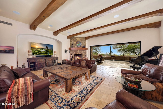 living room with a fireplace and beamed ceiling