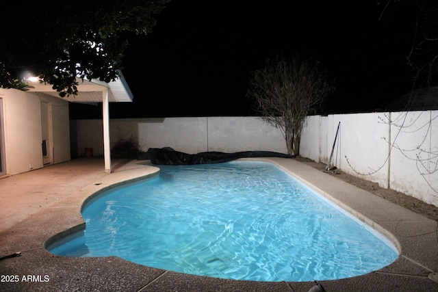 view of pool featuring a patio area, a fenced backyard, and a fenced in pool