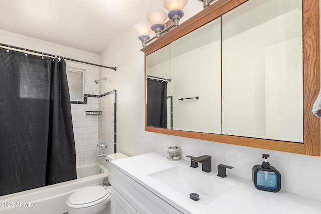 bathroom with shower / bath combo with shower curtain, toilet, and vanity