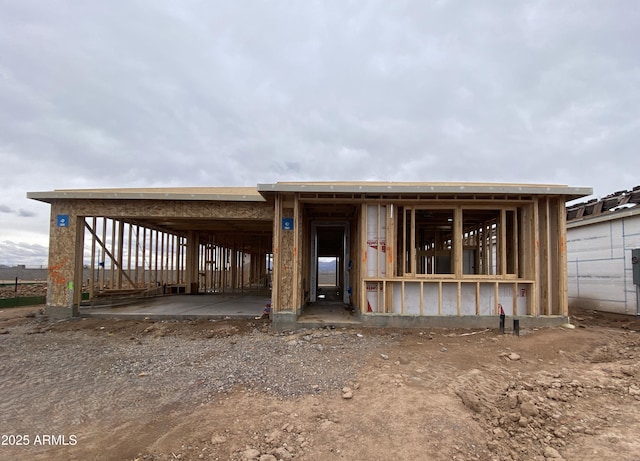 rear view of property featuring an attached carport