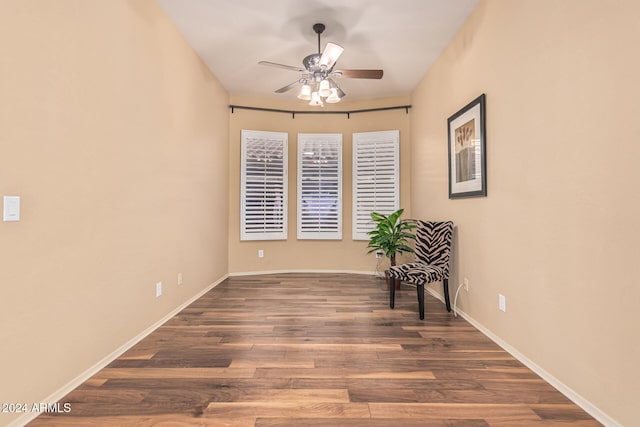 unfurnished room with dark hardwood / wood-style floors and ceiling fan