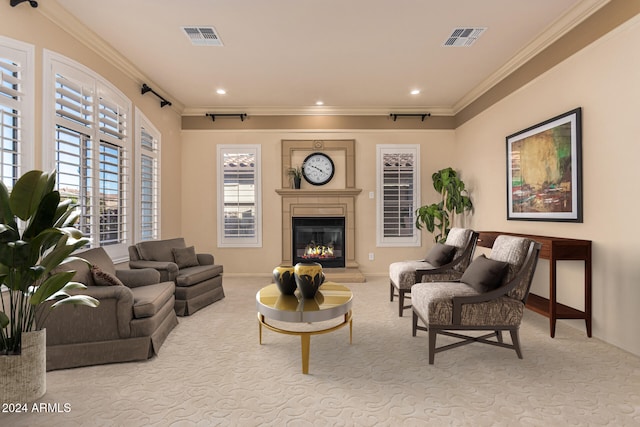 carpeted living room featuring ornamental molding