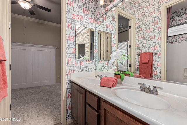 bathroom with ceiling fan, vanity, and ornamental molding