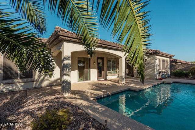 view of swimming pool featuring a patio area