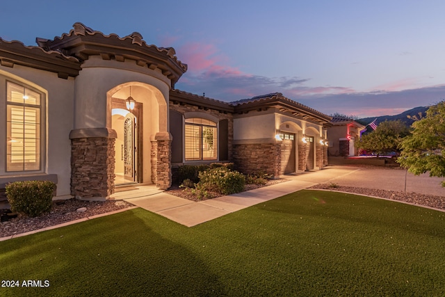 exterior space with a yard and a garage