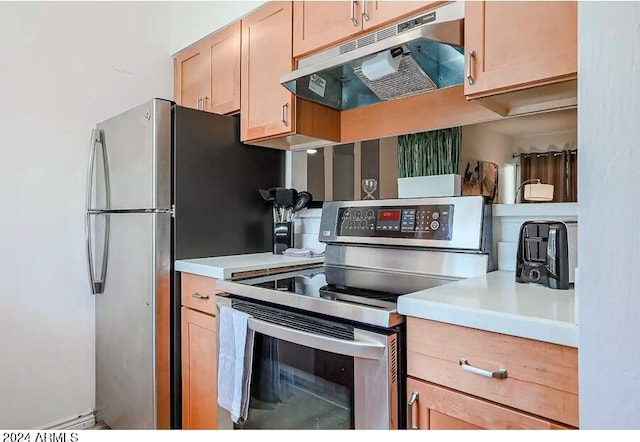 kitchen with light brown cabinetry and stainless steel appliances