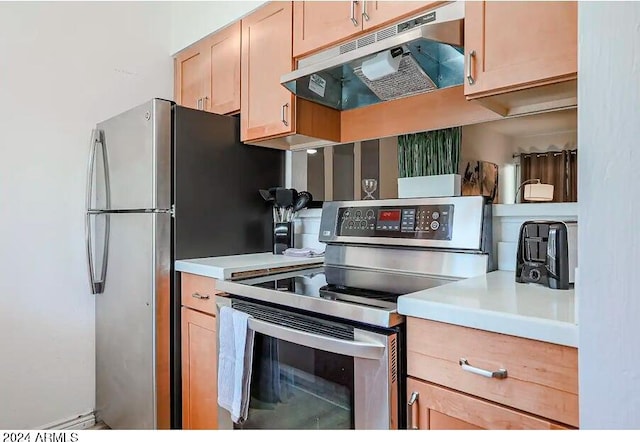 kitchen featuring under cabinet range hood, light countertops, stainless steel range with electric cooktop, and light brown cabinets