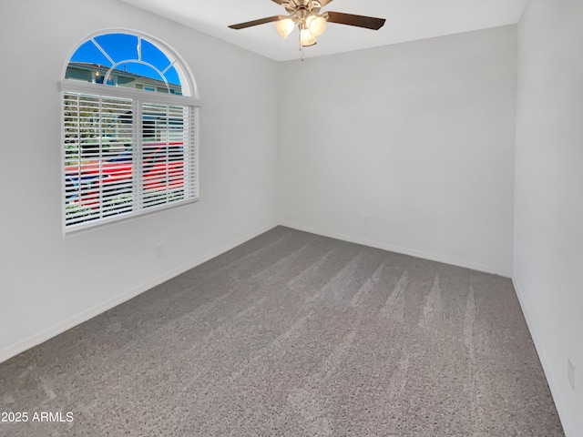 21081 W Almeria Rd, Buckeye, AZ 85396 - unfurnished room featuring ceiling fan, baseboards, and carpet