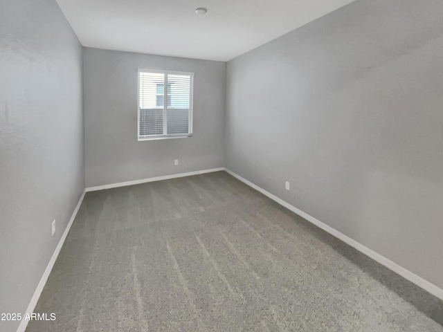 21081 W Almeria Rd, Buckeye, AZ 85396 - carpeted empty room featuring baseboards
