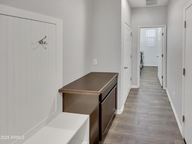 21081 W Almeria Rd, Buckeye, AZ 85396 - hallway featuring baseboards and visible vents