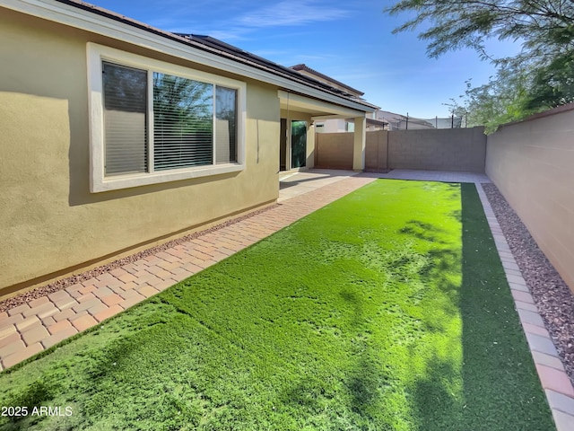 21081 W Almeria Rd, Buckeye, AZ 85396 - view of yard featuring a fenced backyard and a patio