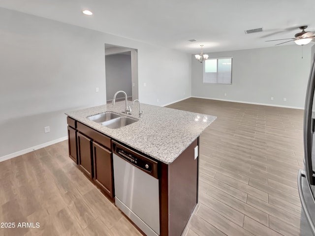 21081 W Almeria Rd, Buckeye, AZ 85396 - kitchen featuring a sink, baseboards, visible vents, ceiling fan with notable chandelier, and appliances with stainless steel finishes