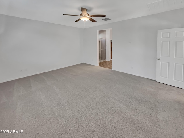21081 W Almeria Rd, Buckeye, AZ 85396 - carpeted empty room featuring visible vents, a ceiling fan, and baseboards